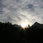 mountains with sun setting behind