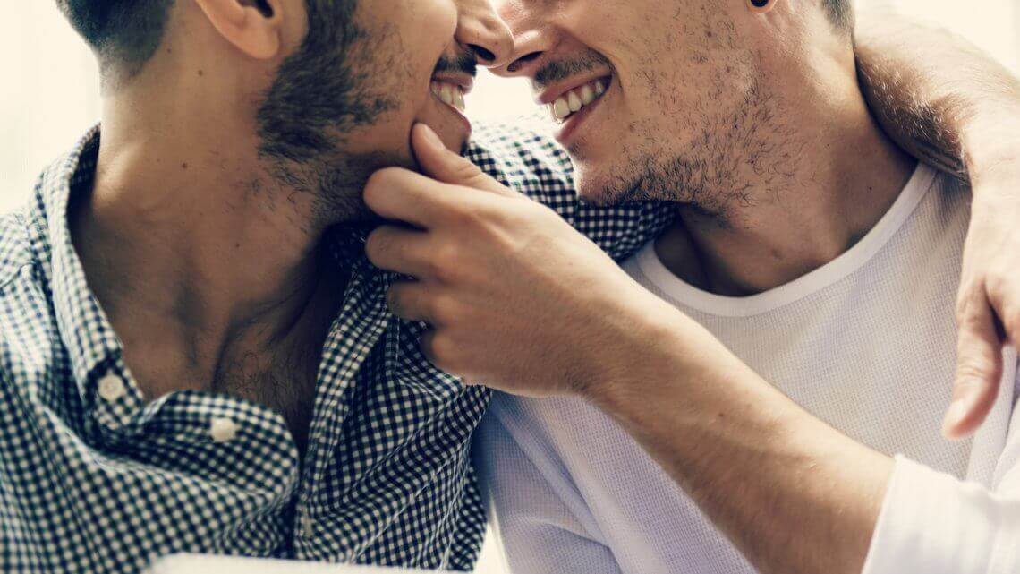 two men about to kiss